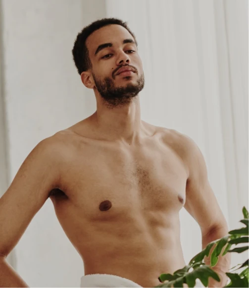 shirless man with towel around waist HIM plastic Surgery In Dallas, TX